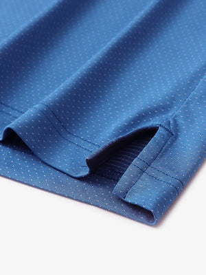 Detail of side slit hem on BLUE 4 Way Stretch Jacquard Polo — clean stitching and stretch finish