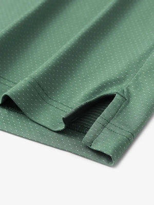 Detail of side slit hem on BERYL GREEN 4 Way Stretch Jacquard Polo — clean stitching and stretch finish