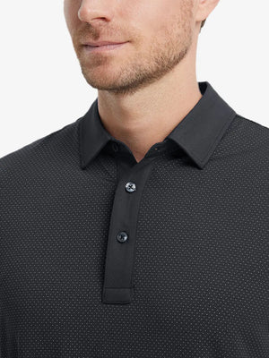 Close-up front shot from nose to chest of model wearing BLACK 4 Way Stretch Jacquard Polo