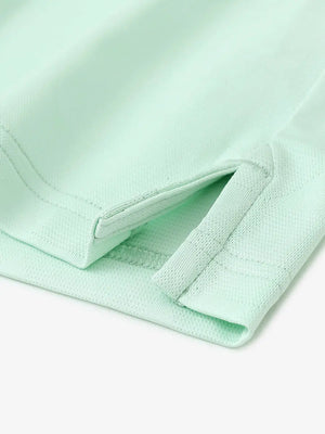 Close-up detail of hem opening on Modern Texture Stylish Polo in MINT GREEN.