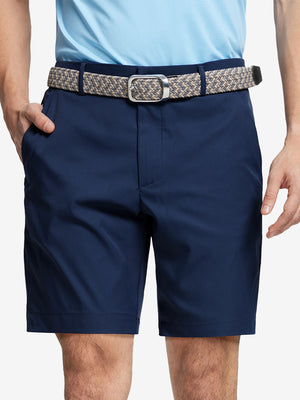 Front waist to knee view of navy water resistant golf 9 inch shorts, clean athletic fit.