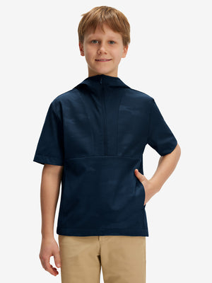 Front waist-up shot of model wearing navy water-resistant short sleeve q-zip hoodie for boys