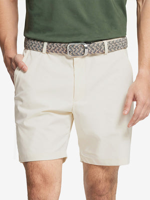 Front waist to knee view of beige water resistant golf 7 inch shorts, clean athletic fit.