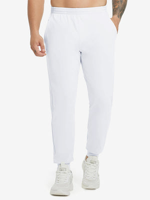 Model wearing Water Resistant Comfy Fleece Golf Joggers in white, lower body front view