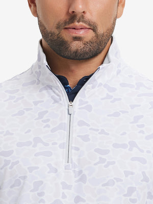 Close-up from nose to chest, showing zipper collar detail and fabric pattern of the brown grey camo pullover.