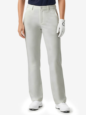 Front lower body shot of model wearing silver grey women's regular fit stretchy golf pants