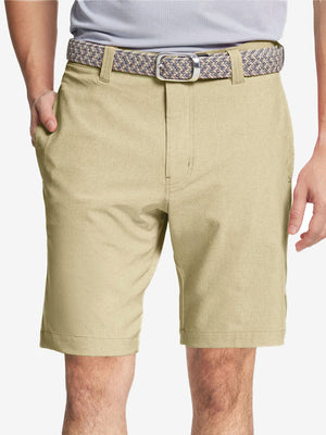 Front view of youth wearing khaki Heather Performance Golf Shorts, showing fit and style