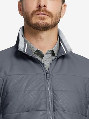Close-up from nose to chest, showing collar detail and fleece texture of the dark grey winter jacket.