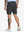Back lower-body view of model in DARK GREY Water Resistant Versatile 8 Pockets Shorts.
