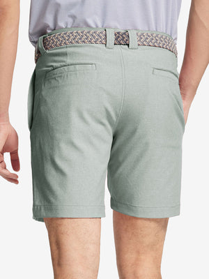 Back view of youth in glacier grey Heather Performance Golf Shorts, highlighting rear design and fit