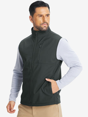 Model front half-body shot with one hand in pocket wearing sleeveless softshell fleece outdoor vests with 6 pockets in grey