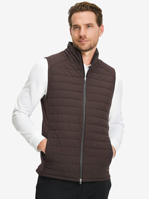 Model wearing Lightweight Water Resistant Puffer Vest in coffee brown, upper body front view