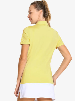 Back-side half-body shot of model in YELLOW Women's Performance Solid Polo, looking over shoulder