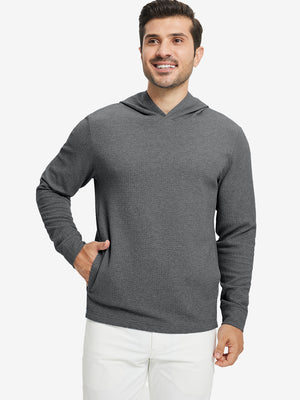 Model front upper body, one hand in pocket, wearing texture solid hoodies pullover, grey heather.