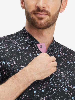 Close-up: nose to chest in black splatter stretch printed collarless henley golf shirts