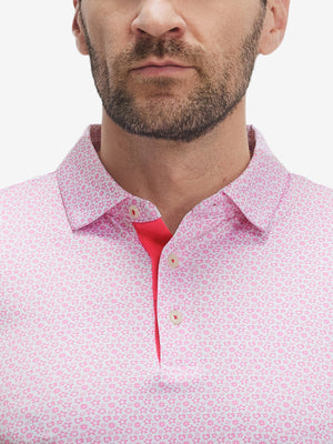 Close-up of lower face and upper shirt in Performance quick dry print golf polos, white pink floral detail