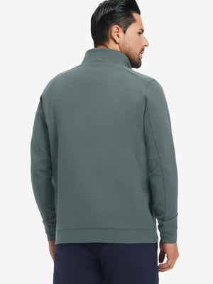 Back upper-body view of water-resistant zip up golf jacket on model, shown in dark dusty blue.