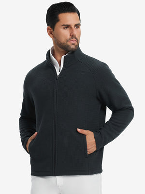 Model with both hands in pockets, wearing soft winter fleece jackets in black, warm and relaxed.