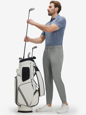 Front full body shot of model wearing iron grey flat front golf joggers pants with belt loops