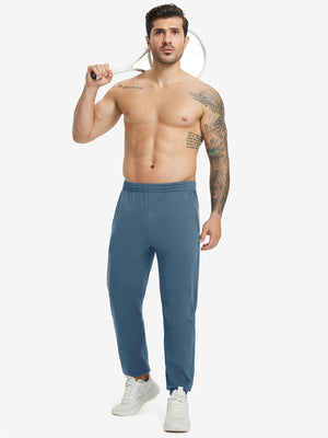 Full body front view of model wearing Water Resistant Comfy Fleece Golf Joggers in bluish grey