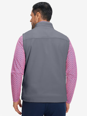 Model's upper body back view wearing dark grey windproof fleece reversible golf vest.