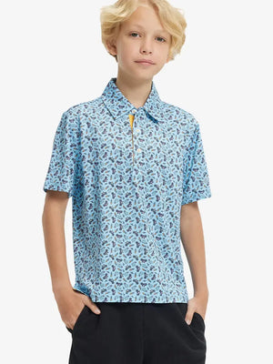 Front half-body shot of boy model in BLUE TRIATHLON Performance Print Boys Golf Polo, ready to play