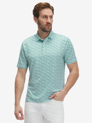 Front half-body shot of model wearing the green lucky clover 4 way stretch print collared polo shirt for a casual sporty look
