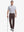 Full-body front shot with golf club, styled in Stretch Plain Everyday Pants – DARK BROWN