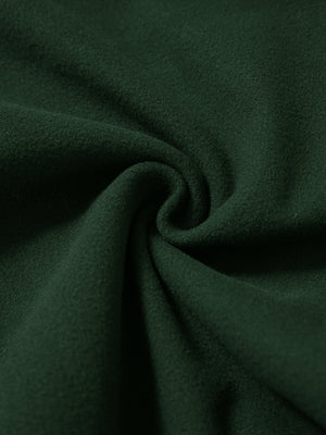 Fabric close-up of forest green water resistant comfy fleece golf joggers, soft fleece texture with water-resistant finish.