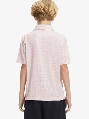 Back half-body view of boy wearing ORANGE SEA WAVE Performance Print Boys Golf Polo outdoors