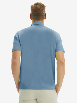 Back half-body view of model wearing the misty blue ventilated pique performance polo, highlighting the rear silhouette