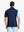 Back half-body view of model in NAVY Moisture Wicking Color Block Polo Shirt.