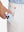 Side pocket detail of Golf Lightweight Fleece Lined Dress Pants in oyster gray, holding smartphone