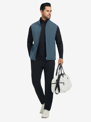 Lifestyle shots of water-resistant fleece golf vests in bluish grey, worn while holding golf bag