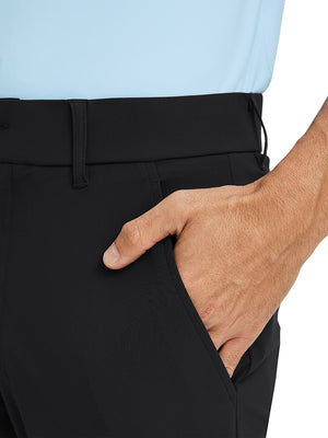 Close-up detail of one hand resting in pocket, showing relaxed fit of the black quick dry pants.