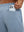 Close-up of iPhone partly inside pocket of blue heather soft sweatpants with 4 zipper pockets