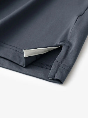 Hem slit detail of DARK GREY Moisture Wicking Color Block Polo Shirt highlighting stitching and finish.