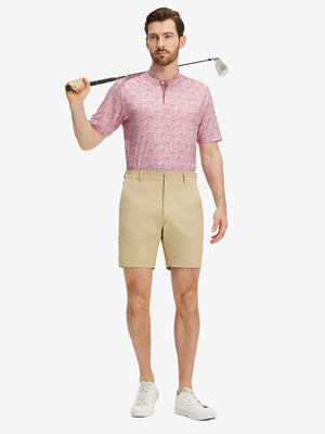 Full front: model in pink beach palm stretch printed collarless henley golf shirts holding golf club.