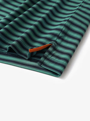 Close-up of hem slit detail on Turquoise Navy Yarn Dyed Stripe Polo