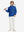 Youth Winter Micro-fleece Quarter Zip Pullover in klein blue, model carrying golf clubs on shoulder
