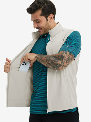 Close-up of water-resistant fleece golf vests pocket holding a phone, practical detail in oyster grey