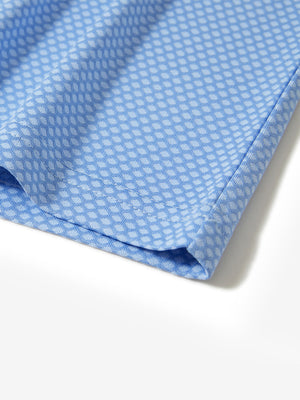 Hem detail of jacquard quarter zip pullover in light blue, focusing on stitching and side vent finish.