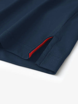 Hem slit detail of NAVY Stylish Chest Print Snap Polo highlighting stitching and finish