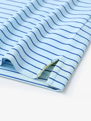 Hem slit detail of LIGHT BLUE/COBALT STRIPE Polo with clean cobalt accent