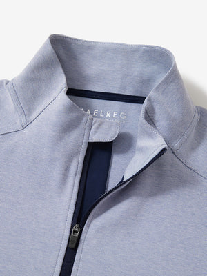 Close-up collar detail of sky blue two tone pique cotton blend q-zip with subtle logo