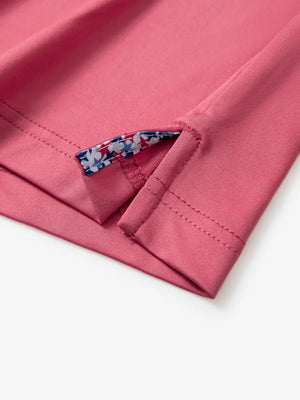 Close-up of side slit detail on the Cranberry Everyday Classic Solid Polo hem