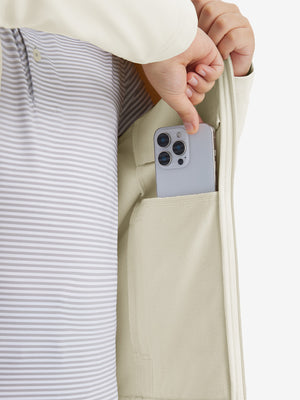 Close-up of the front side pocket detail on kids soft lightweight fleece lined jacket in beige, showing quality stitching.