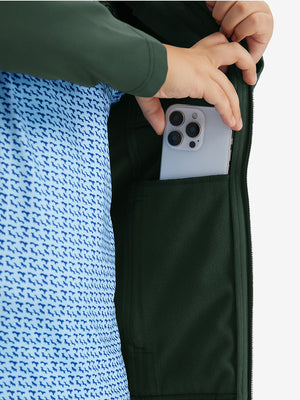 Close-up of the front side pocket detail on kids soft lightweight fleece lined jacket in forest green, showing quality stitching.