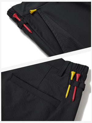 Waistband detail of lightweight flat front casual trousers in black, showing clean stitching.