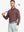 Model wearing Brick Heather Skin-friendly Long Sleeve Melange Polo – front half-body holding golf club
